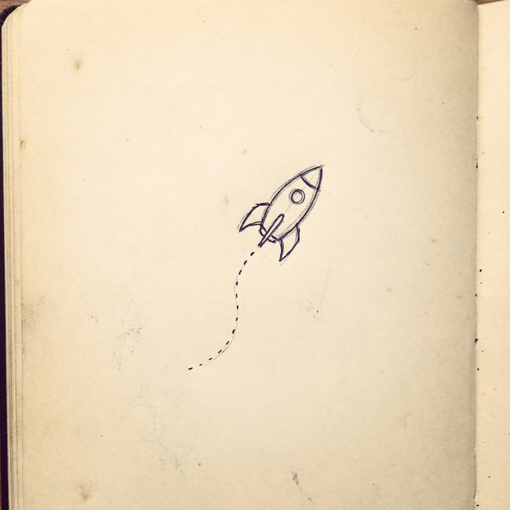 Hand-drawn rocket with dashed flight trail